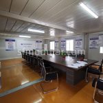 Furnished prefabricated office space with desks and meeting area