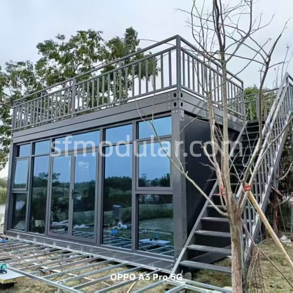 real modular coffee shop structure with glass curtain wall, rooftop guardrail and exterior staircase for customization reference