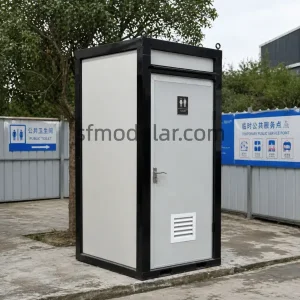 Mobile toilet unit used in a temporary public sanitation project with outdoor service signage