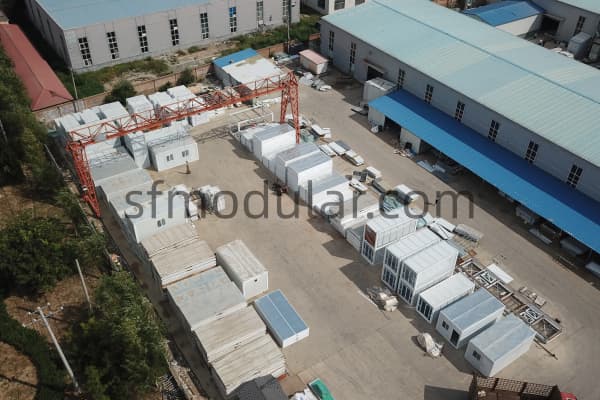 Sunfine prefab housing factory yard with finished units waiting for loading
