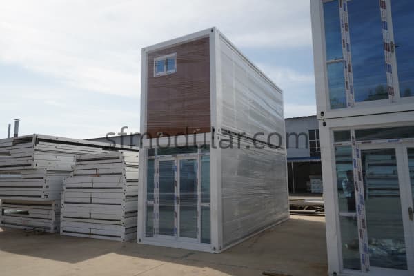 Finished modular housing unit wrapped before shipment