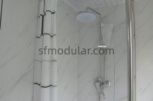Shower set detail inside portable toilet with shower