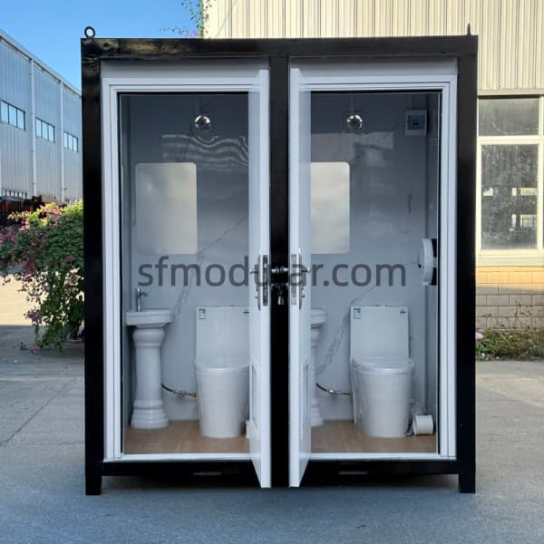 double-portable-construction-toilet-interior-view Interior view of double portable construction toilet with ceramic toilets, wash basins, mirrors, and separate rooms