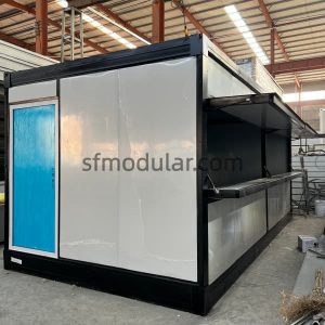 foldable container house coffee shop version with white wall panels, blue door and side serving window