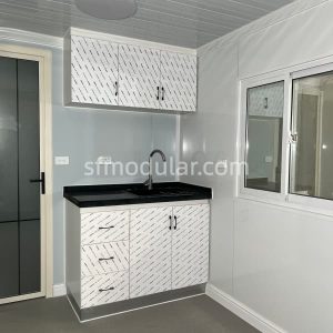 Kitchen cabinet area inside a compact granny pod for backyard living