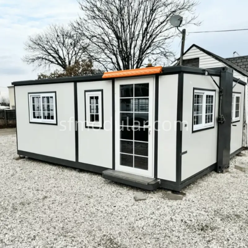 A finished small expandable home installed on a gravel foundation, showing its practical residential application