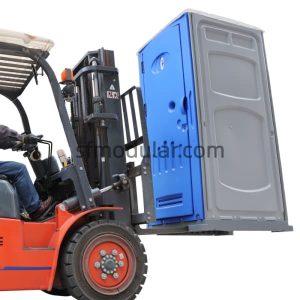 Forklift loading a portable toilet for events for easy transport and handling