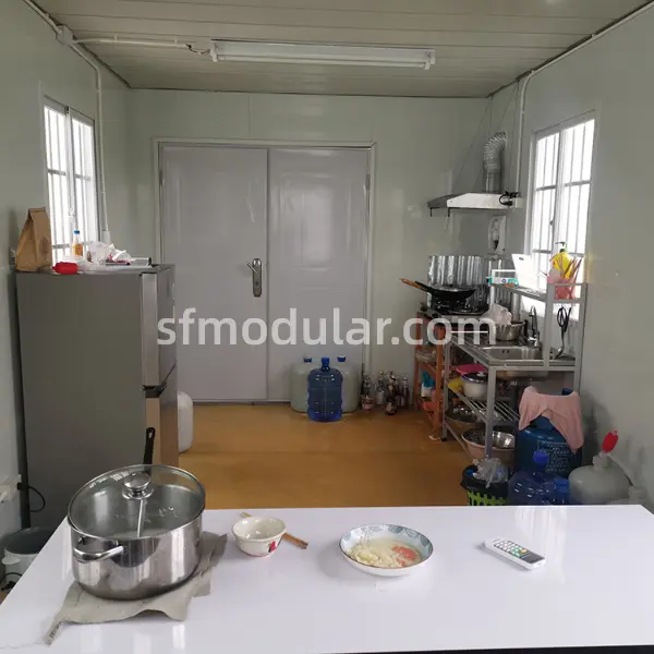 Affordable temporary housing kitchen facilities inside a Sunfine modular container home for construction workers.