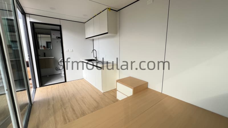 Apple cabin kitchenette and living area interior