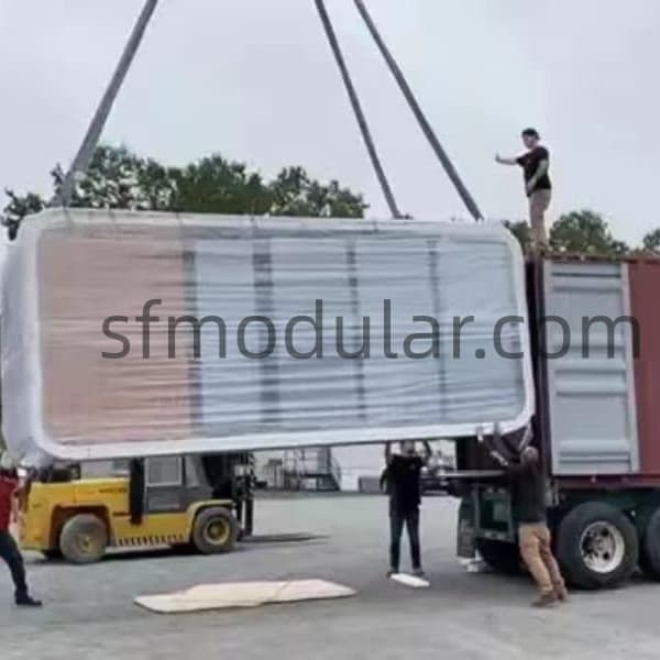 apple-cabin-module-lifting Two story apple cabin module being lifted for loading