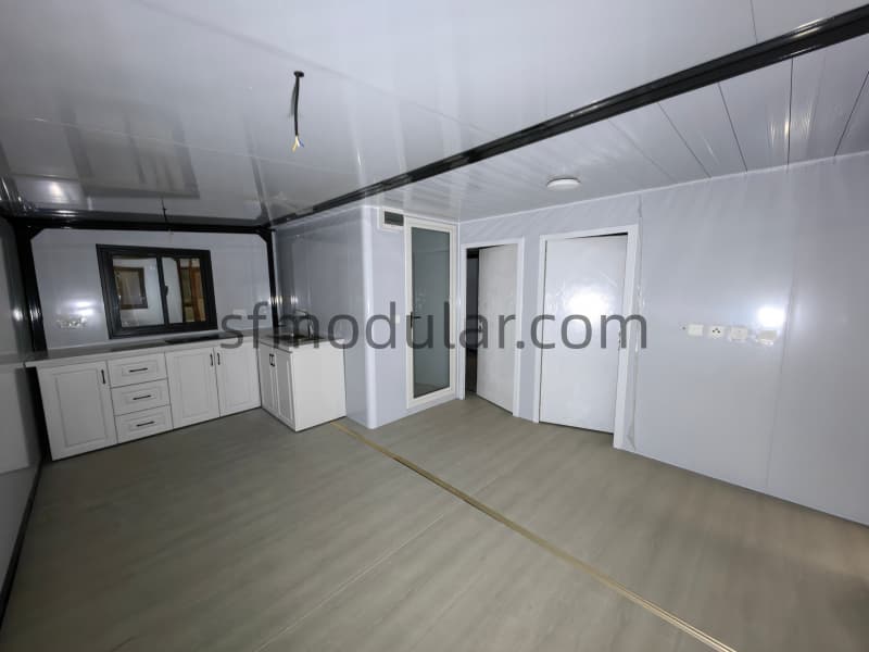 Interior kitchen space of expandable tiny home on wheels