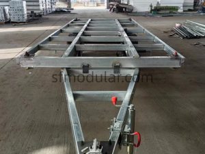 Towing frame detail for expandable tiny home trailer chassis