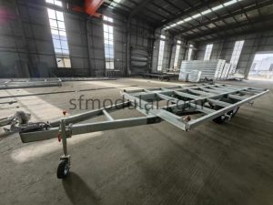 Trailer chassis side view for expandable tiny home on wheels
