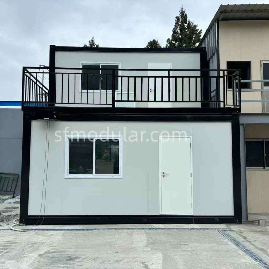 Front view of two story ADU modular homes with balcony and white exterior