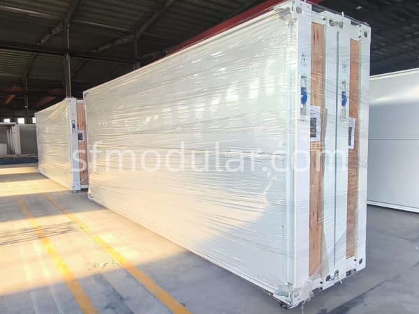 Professional and secure packaging of flat pack container house units in the factory