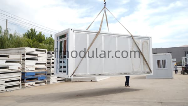 Expandable container house crane unloading on site