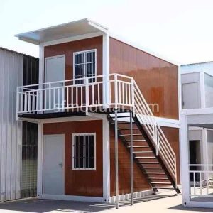 Two-story mining camp accommodation with external stairs and balcony corridor