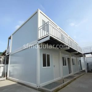 Two-story mining camp building side view with corridor and modular camp structure