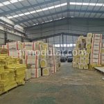 Insulation panel storage for flat pack container house production in factory